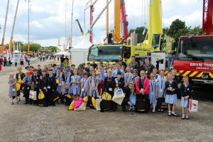 Allanson Street Primary School children collecting their goody bags from the Liebherr stand