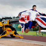 Athlete Ben jumps for joy after landing JCB sponsorship
