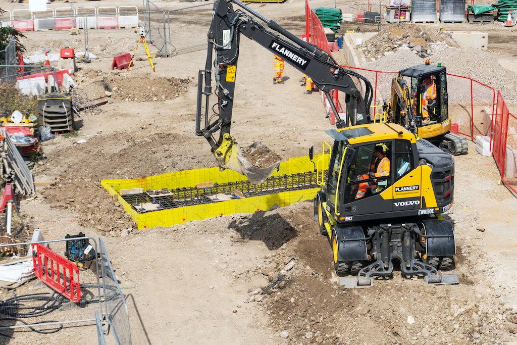 Flannery is using the UK's first EWR130E wheeled excavator from SMT GB to construct the bases for a conveyor that will transport material away from the crossover box dig out works.