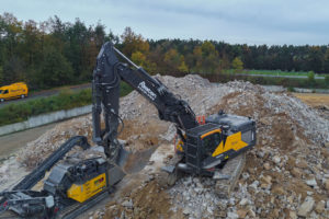 A custom-made quick-change boom system on its Volvo CE EC380E HR is helping Austen GmbH make light work of demolition projects.
